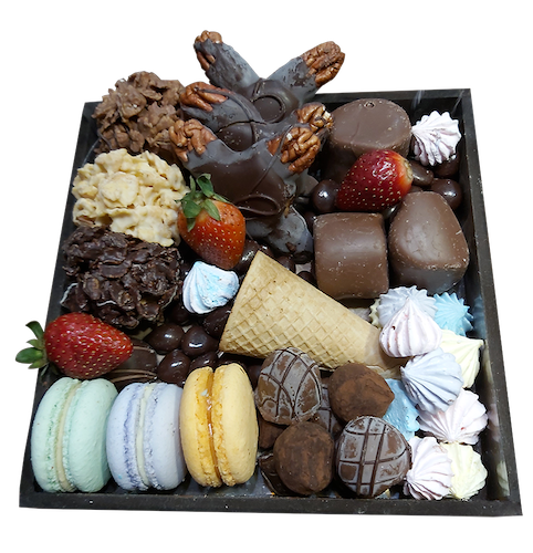 Variedad de chocolaes, macarrones y merengues